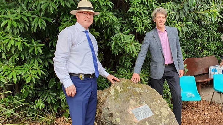 Mayor Jamieson and Councillor Law beside the rock which bears the dedication plaque.